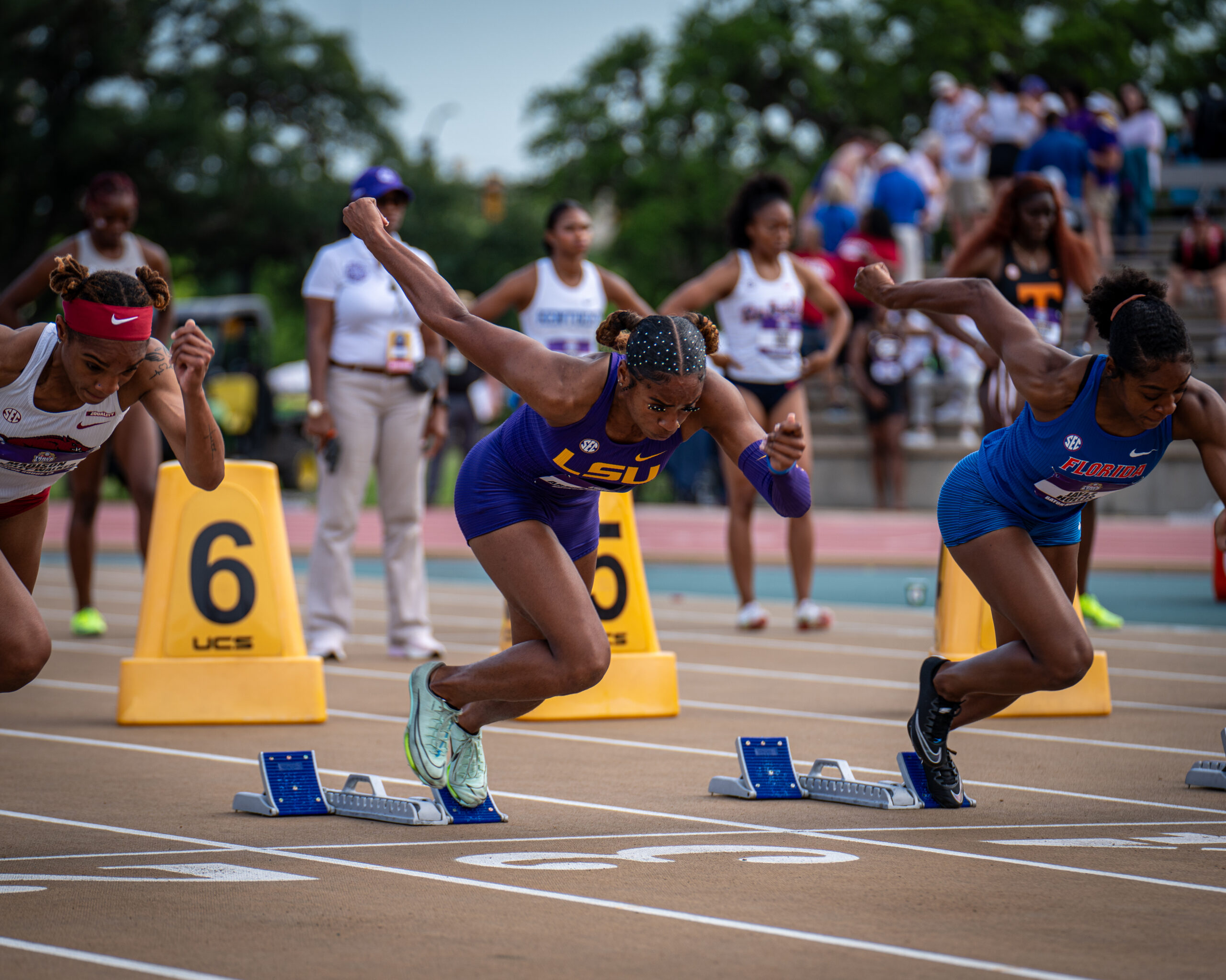 Athletes accelerating out of starting blocks